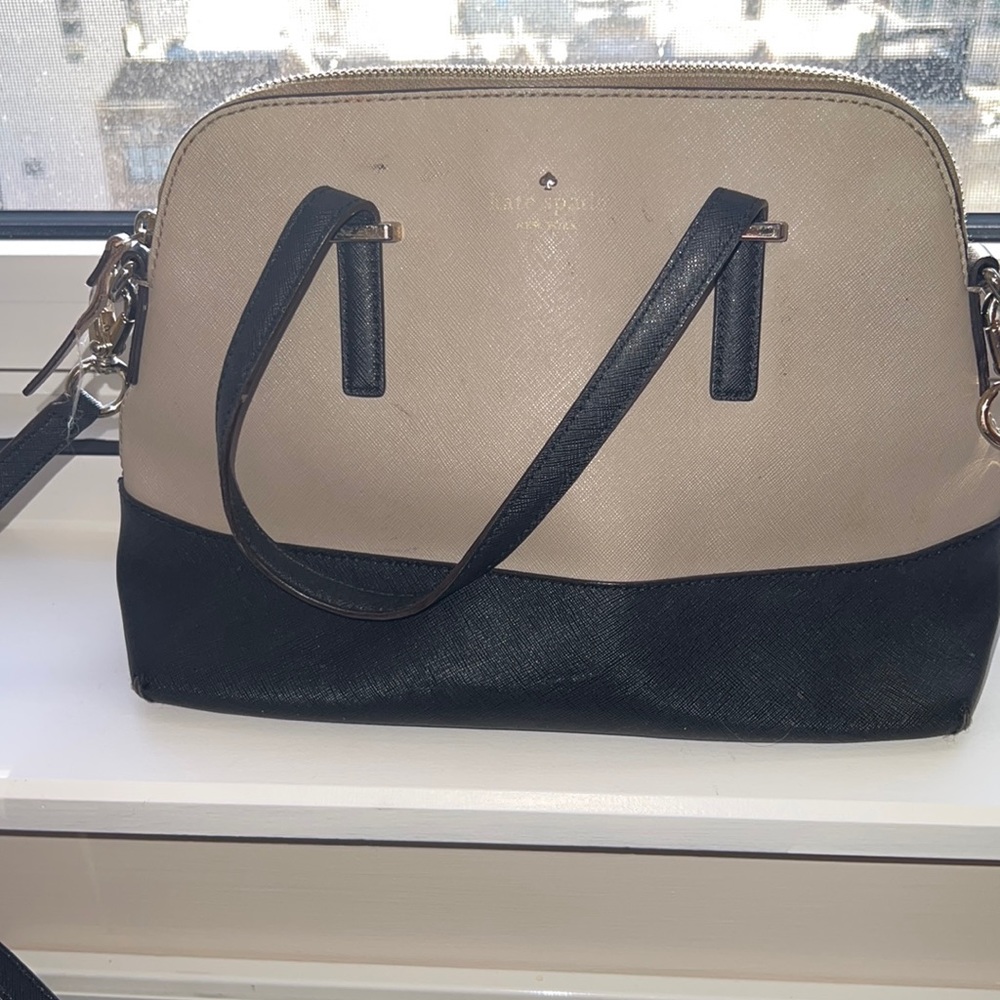 Kate Spade bought back in 2015.  In fair condition.  See pictures